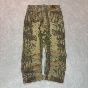 90's Brown and tan camouflage jeans with a distressed look
